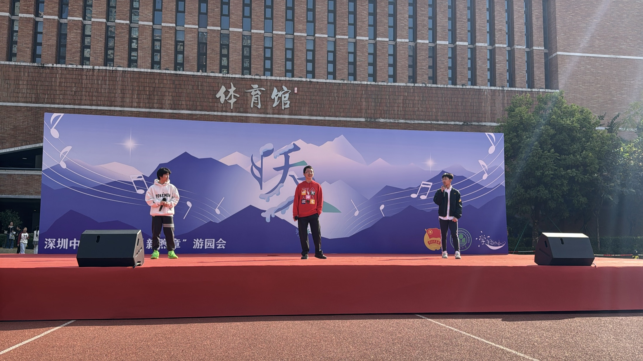 Ben and fellow performers on an outdoor stage